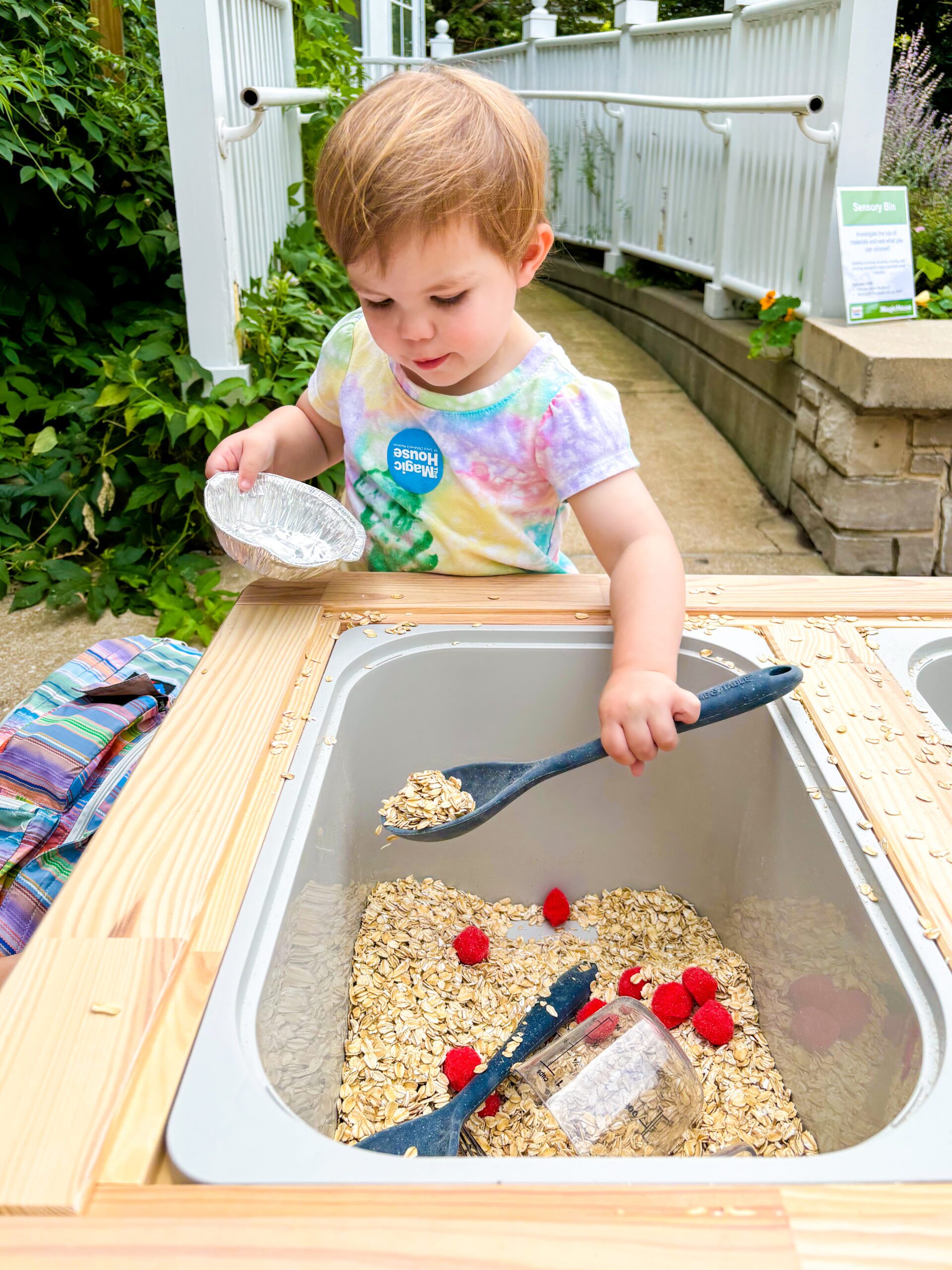 Child doing craft with oatmeal, bowl and spoon