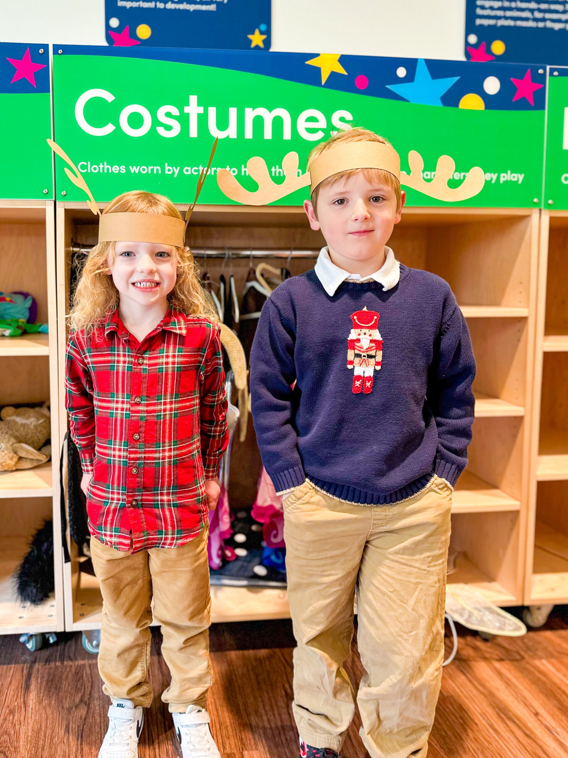 Two boys wearing reindeer antler crafts in Back Stage Magic
